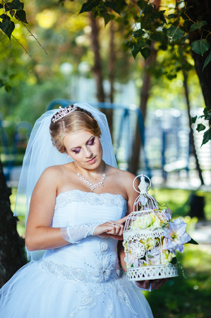 Beautiful bride posing in her wedding day.の写真素材