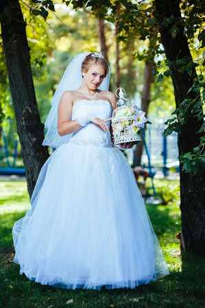 Beautiful bride posing in her wedding day.の写真素材