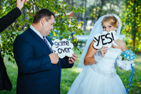 Wedding shot of bride and groom in park.の写真素材