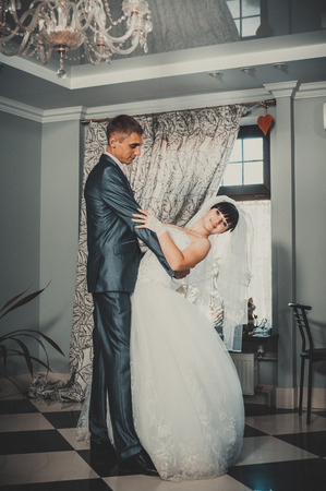 Charming bride and groom on their wedding celebration in a luxurious restaurant.の写真素材