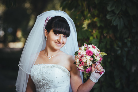 Beautiful bride posing in her wedding day.の写真素材