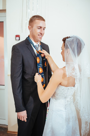 beautiful caucasian couple just married and dancing their first dance.の写真素材