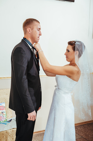beautiful caucasian couple just married and dancing their first dance.の写真素材