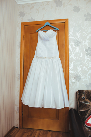 White Wedding dress on a shoulders before ceremonyの写真素材