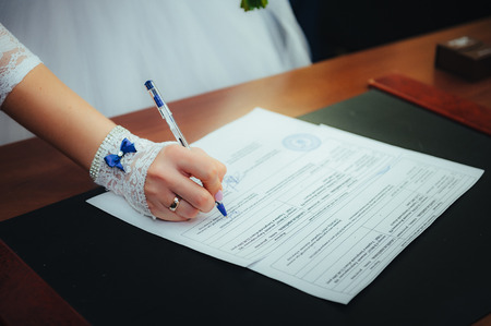 Wedding ceremony. Wedding couple leaving their signatures.