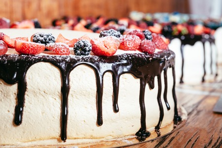 cake decorated with strawberry, raspberry and blackberry.の写真素材