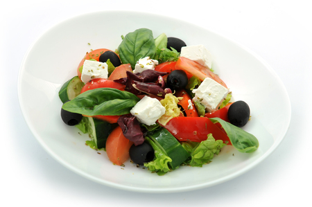 fresh Greek vegetable salad isolated on white background.の写真素材