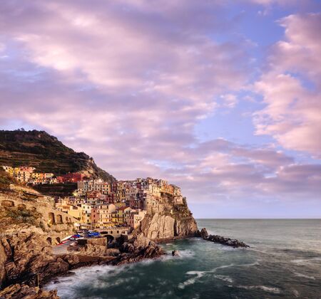 Beautiful view of Vernazza - a village in the National park of Cinque Terre, Italy. Colorful harbor...