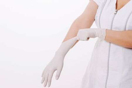 Coronavirus. 2019-nCoV. Woman doctor hands wears medical latex blue gloves to help protect herself...
