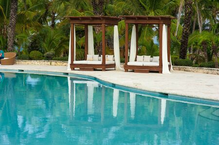 Pool bed at the blue swimming pool in Tropical Paradise. Dominican Republic, Seychelles, Caribbean, Mauritius, Philippines, Bahamas. Relaxing on remote Paradise beach.の写真素材