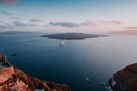 Oia Santorini Greece famous with romantic and beautiful sunsets. Oia village in Santorini island.Greece.の写真素材