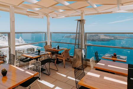 Romantic restaurant. Greece, Santorini, restaurant above the volcanoの写真素材