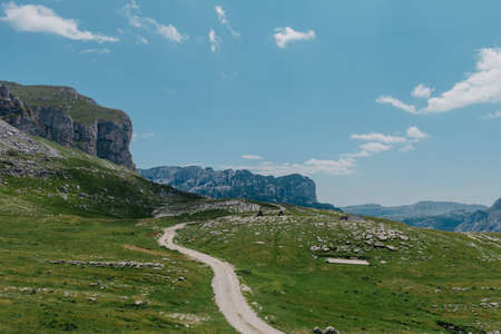 Amaizing view on Durmitor mountains, National Park, Mediterranean, Montenegro, Balkans, Europe. Bright summer view from Sedlo pass. The road near the house in the mountains.の写真素材