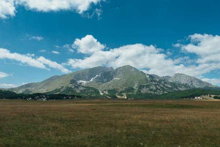Amaizing view on Durmitor mountains, National Park, Mediterranean, Montenegro, Balkans, Europe. Bright summer view from Sedlo pass. The road near the house in the mountains.の写真素材