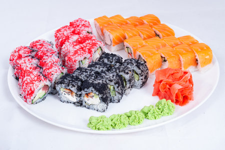Japanese seafood Sushi roll isolated on white close up. Japanese food restaurant, sushi maki gunkan roll plate or platter set. Maki Sushi rolls with salmon and avocado. Sushi isolated at white background. flat lay. Japanese Cuisine - Sushi Roll with Shrimps and Conger, Avocado, Tobiko and Cheese. sushi rolls tempura,japanese food style ,Traditional Japanese cuisine, Crunchy Shrimp Tempura Rollの写真素材
