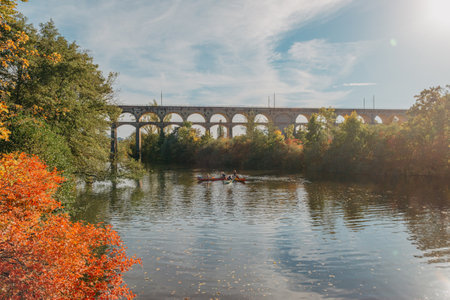 Railway Bridge with river in Bietigheim-Bissingen, Germany. Autumn. Railway viaduct over the Enz River, built in 1853 by Karl von Etzel on a sunny summer day. Bietigheim-Bissingen, Germany. Old viaduct in Bietigheim reflected in the river. Baden-Wurttemberg, Germany. Train passing a train bridge on a cloudy day in Germanyの写真素材