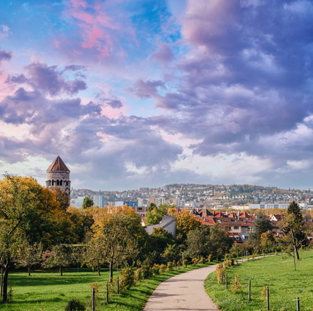 Germany, Stuttgart panorama view. Beautiful houses in autumn, Sky and nature landscape. Vineyards in Stuttgart - colorful wine growing region in the south of Germany with view over Neckar Valley. Germany, Stuttgart city panorama view above vineyards, industry, houses, streets, stadium and highway at sunset in warm orange lightの写真素材
