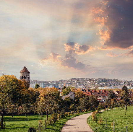 Germany, Stuttgart panorama view. Beautiful houses in autumn, Sky and nature landscape. Vineyards in Stuttgart - colorful wine growing region in the south of Germany with view over Neckar Valley. Germany, Stuttgart city panorama view above vineyards, industry, houses, streets, stadium and highway at sunset in warm orange lightの写真素材