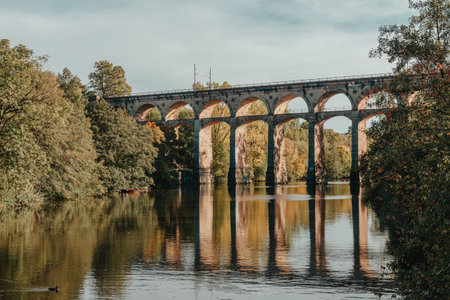Railway Bridge with river in Bietigheim-Bissingen, Germany. Autumn. Railway viaduct over the Enz...