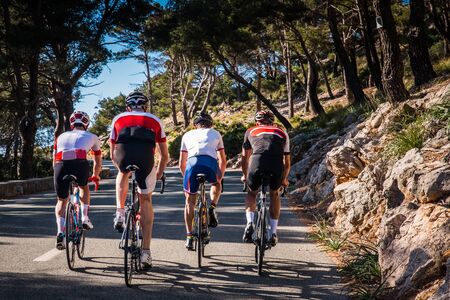 Group of triathletes on road bicycle, sport photo in nature. Majorca., Spainの写真素材