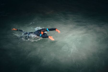 Swimmer in the sea, open water, triathlon training