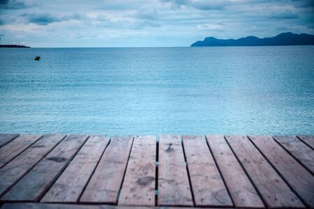 Wooden pier in cloudy morning. Rest, silent. Melancholy concept photoの写真素材