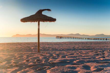 Umbrella on the beach Playa de Muro.. Morning in summer vacation resortの写真素材