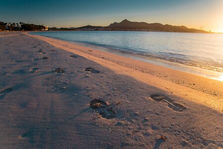 Footprints in the sand, beautiful summer beach Playa de Muro.. Mallorcaの写真素材