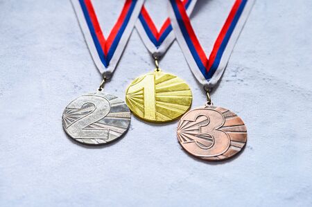 Gold silver and bronze medal on white background