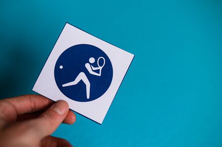 Tennis player pictogram, sport icon, blurred background. Symbol of tennis in summer game Tokyo 2020のeditorial素材