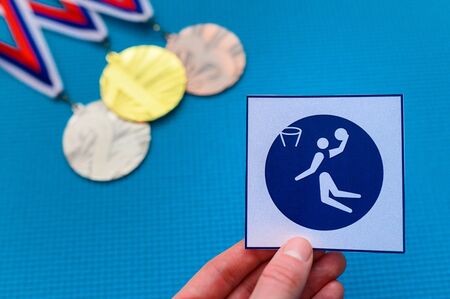 Basketball icon, blue edit , medal set in background.の写真素材