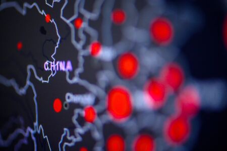 China . Coronavirus COVID-19 global cases Map. Red Dot showing the number of infected. Johns Hopkins University map on monitor display.の写真素材