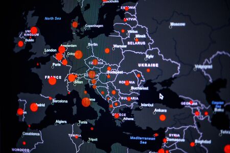 Europe . Coronavirus COVID-19 global cases Map. Red Dot showing the number of infected. Johns Hopkins University map on monitor display.の写真素材
