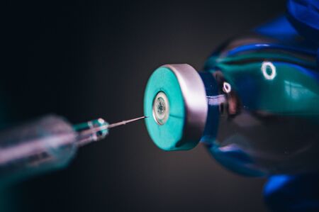Coronavirus Covid-19 Protection and Vaccine. Medicine bottle for injection medical glass vials and syringe for vaccinationの写真素材