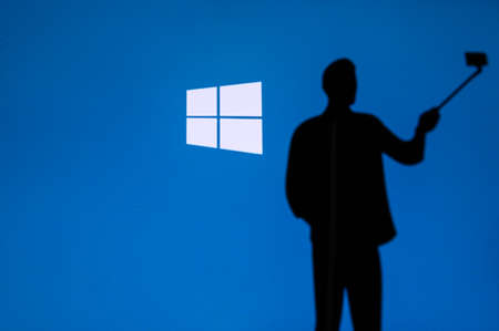 NEW YORK, USA, 25. MAY 2020: Microsoft Windows graphical operating system Man taking a photo on...