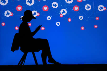 NEW YORK, USA, 25. MAY 2020: Facebook online social media and social networking Young woman...