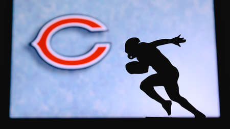 Chicago Bears. Silhouette of professional american football player. Logo of NFL club in background, edit space.のeditorial素材