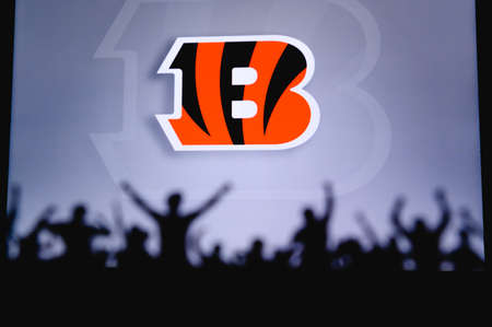 Cincinnati Bengals. Fans support professional team of American National Foorball League. Silhouette of supporters in foreground. Logo on the big screen.のeditorial素材