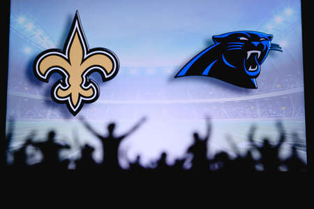 New Orleans Saints vs. Carolina Panthers. Fans support on NFL Game. Silhouette of supporters, big...
