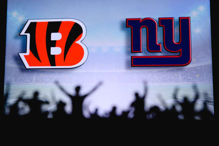 Cincinnati Bengals vs. New York Giants. Fans support on NFL Game. Silhouette of supporters, big...