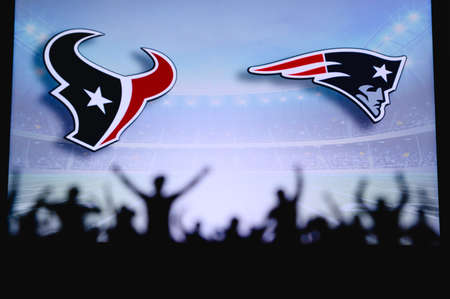 Houston Texans vs. New England Patriots. Fans support on NFL Game. Silhouette of supporters, big screen with two rivals in background.のeditorial素材