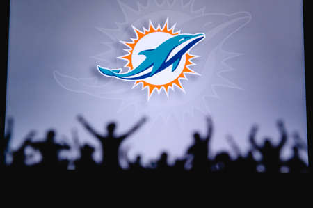 Miami Dolphins. Fans support professional team of American National Foorball League. Silhouette of...