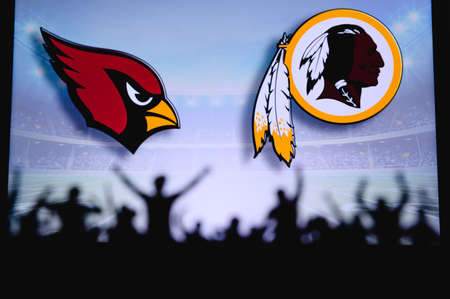 Arizona Cardinals vs. Washington Redskins. Fans support on NFL Game. Silhouette of supporters, big...