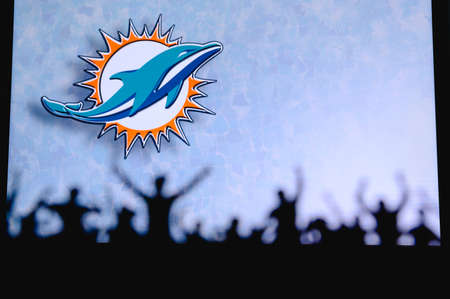 Miami Dolphins. Fans support professional team of American National Foorball League. Silhouette of...