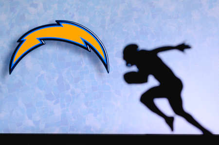 Los Angeles Chargers. Silhouette of professional american football player. Logo of NFL club in...