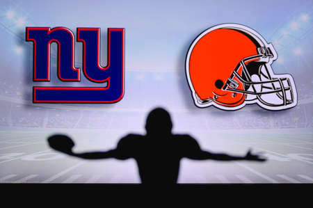 New York Giants vs. Cleveland Browns. NFL Game. American Football League match. Silhouette of...