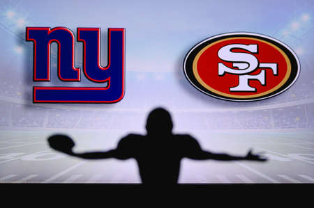 New York Giants vs. San Francisco 49ers. NFL Game. American Football League match. Silhouette of...