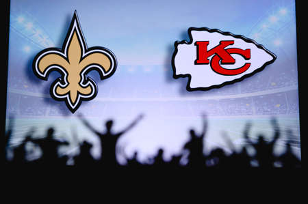 New Orleans Saints Kansas City Chiefs. Fans support on NFL Game. Silhouette of supporters, big screen with two rivals in background.のeditorial素材