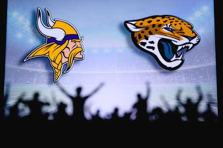 Vikings vs. Minnesota Vikings Jacksonville Jaguars. Fans support on NFL Game. Silhouette of supporters, big screen with two rivals in background.のeditorial素材