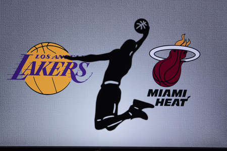ORLANDO, USA. SEPTEMBER. 19: NBA Final 2020, Los Angeles Lakers vs Miami Heat. Covid Season final in Bubble. Silhouette of basketball player. Logos of NBA Finalists on the screen in background.のeditorial素材